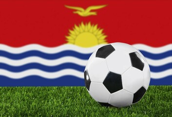 Naklejka premium The Kiribati flag and soccer ball on the green grass
