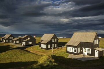 Cottages, cottage settlement in Hellnar, cloud formation, peninsula Snaefellsnes, West Iceland, Iceland, Europe