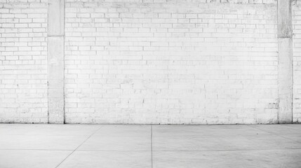 Fototapeta premium Empty industrial space with white brick walls and concrete floor, ideal for creative backgrounds
