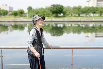 A park with good atmosphere with canal in Toyama Prefecture. Old Japanese woman in her 90s are...