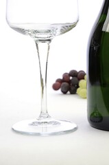 Bottle of white wine with a glass