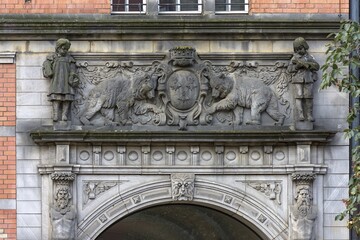 Obraz premium Relief above the main entrance of the Heinrich-Zille primary school built 1901-1902, Berlin, Germany, Europe