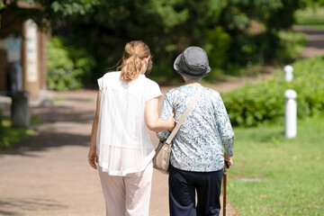 A park with good atmosphere with canal in Toyama Prefecture. Old woman in her 90s and Japanese...