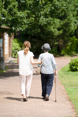 A park with good atmosphere with canal in Toyama Prefecture. Old woman in her 90s and Japanese...