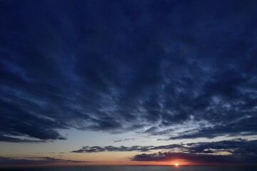 Fototapeta premium Sunset and dark clouds, North Sea, Norway, Europe