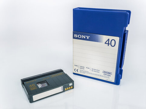 Digital video cassette DVCAM Sony PDVM-40ME Advanced 40 min with case lies isolated on white background with reflection