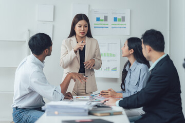Business Strategy Session: A diverse team of business professionals engaged in a lively discussion...