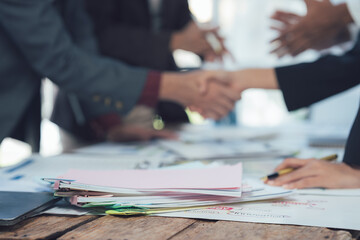 Closing the Deal: A handshake seals a business agreement, signifying partnership and collaboration...