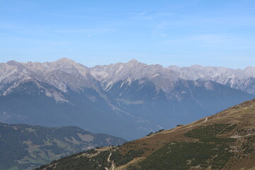 Fototapeta premium Panoramic Alpine Valley with Mountain Ranges