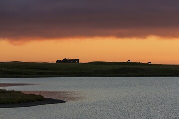 Sunset, behind horses and house ruin, near Grundarfjördur, peninsula Snaefellsnes, Iceland, Europe