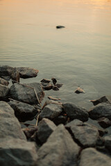 rocks in the lake with gentle ripples in the water
