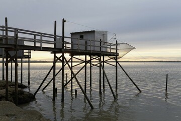 Fototapeta na wymiar Traditional fishing huts built on stilts on the Gironde, fishing nets, Meschers-sur-Gironde, Cote de Beaute, Charente-Maritime, France, Europe
