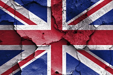 Fototapeta premium Flag of UK painted on cracked wall