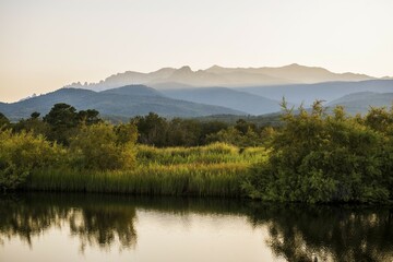 Obraz premium Lagoon and mountains, Sunset, Solenzara, Haute-Corse, Corsica, France, Europe