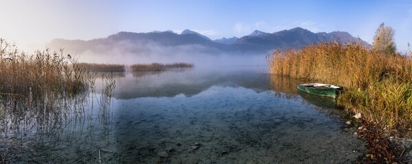 Fototapeta premium Early fog at Lake Weißensee, Füssen, Ostallgäu, Bavaria, Germany, Europe