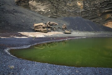Green lagoon, Lago Verde, turned green by algae with a lava beach, Charco de los Clicos, caldera of the El Golfo volcano, volcanic landscape, Lanzarote, Canary Islands, Spain, Europe