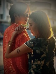 Portrait of Thai couple with Chinese dressing at Yaowarat road, Bangkok, Thailand.