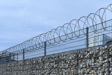Barbed wire secured stone wall, Germany, Europe