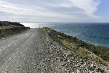 Coastal road, gravel road in Tierra del Fuego, Pan-American Highway between Porvinier and Ushuaia, border to Chile, Argentina, South America