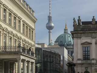 View of historic buildings in the foreground with the Berlin television tower in the background...