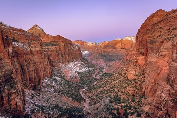 Naklejka premium View from Canyon Overlook into Zion Canyon with snow, at sunrise, back left Bridge Mountain, Zion National Park, Utah, USA, North America