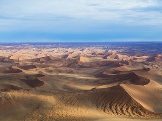 Aerial, view of sand dunes, Kulala Wilderness Reserve on the edge of the Namib Desert, Tsaris...