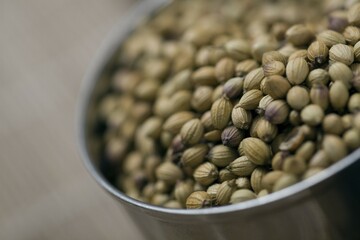 Pepper grains in a chrome bowl
