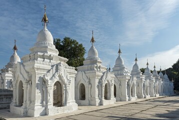 White kyauk gu cave stupas at Kuthodaw Pagoda, Mandalay, Myanmar, Asia