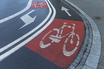 Red marked bicycle paths on the roadway, Krakow, Poland, Europe
