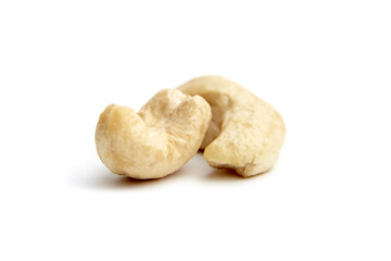 Close-up of two raw cashew nuts placed together on a white background. Ideal for showcasing healthy snacks, vegan diets, or nutritious food options