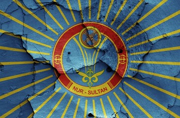 Flag of Nur-Sultan painted on cracked wall