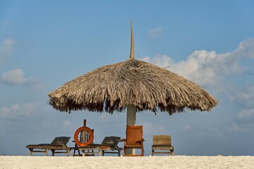 Parasol, sunbeds and a lifebuoy on the beach, Paradise Island, Maldives, Asia