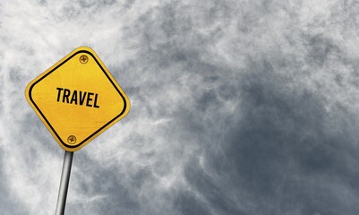 Travel, yellow sign with cloudy sky