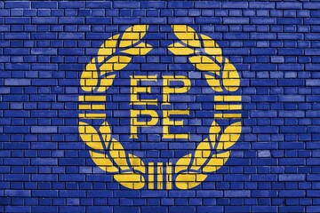 Old flag of European Parliament painted on brick wall