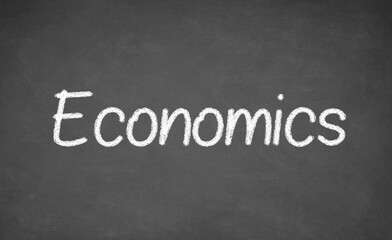 Obraz premium Economics lesson on blackboard or chalkboard. written in white chalk