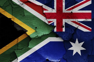 Flags of South Africa and Australia painted on cracked wall