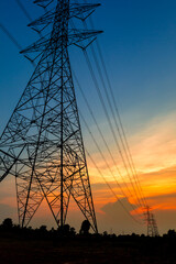 Fototapeta premium Electricity transmission pylon. high-voltage power lines. high voltage post during sunset time