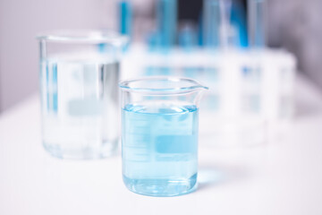 Laboratory beaker blue liquid chemistry chemical research science medical equipment