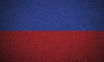 The Haitian flag painted on a cork board