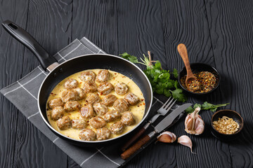 Ground poultry meatballs in a white cream gravy