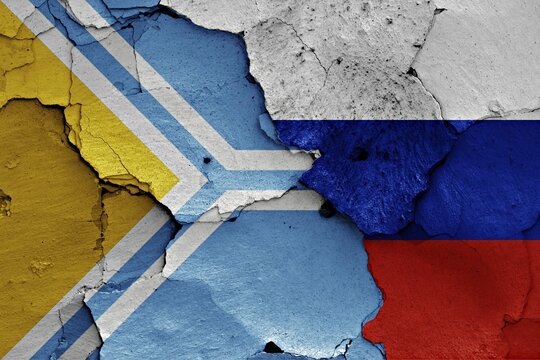 Flag of Tuva and Russia painted on cracked wall