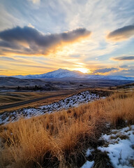 Sunset shots from scenic viewpoints in Idaho with snow-capped mountains.