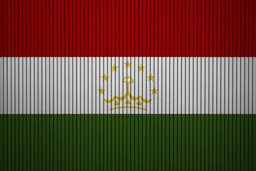 Tajikistan Flag painted on the cracked grunge concrete wall