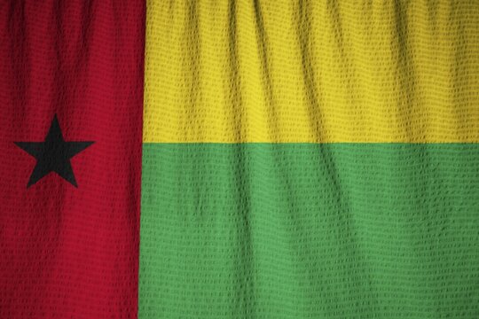 Closeup of Ruffled Guinea-Bissau Flag, Guinea-Bissau Flag Blowing in Wind
