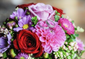 Wedding rings on wedding bouquet