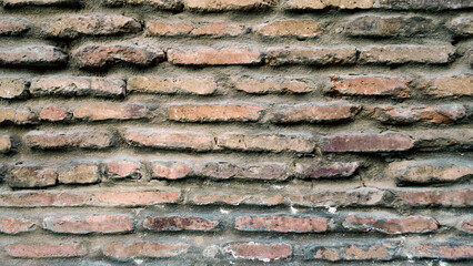 pattern texture of old vintage orange brick wall close up