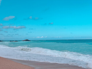 Golden sands meeting the endless blue. The concept of the serenity, beauty, and timeless charm of Greece’s stunning coastline
