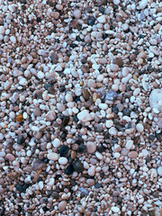 Rocks at the seaside of the Milos Beach in Greece. Seasonal holidays concept, escape, adventure, and the magic of the Greek seaside