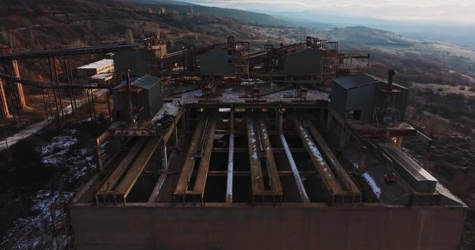Metal Sorting Building Facility Abandoned Soviet Era Heavy Metal Industrial Complex Cinematic Sunrise Aerial Rise Tilt Down