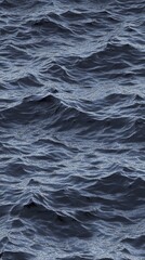 Obraz premium A textured background with dark gray and light blue tones, featuring a grainy pattern that resembles the surface of an icy lake